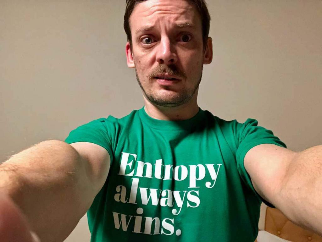 Andy Fossett wearing a shirt that says "Entropy Always Wins."