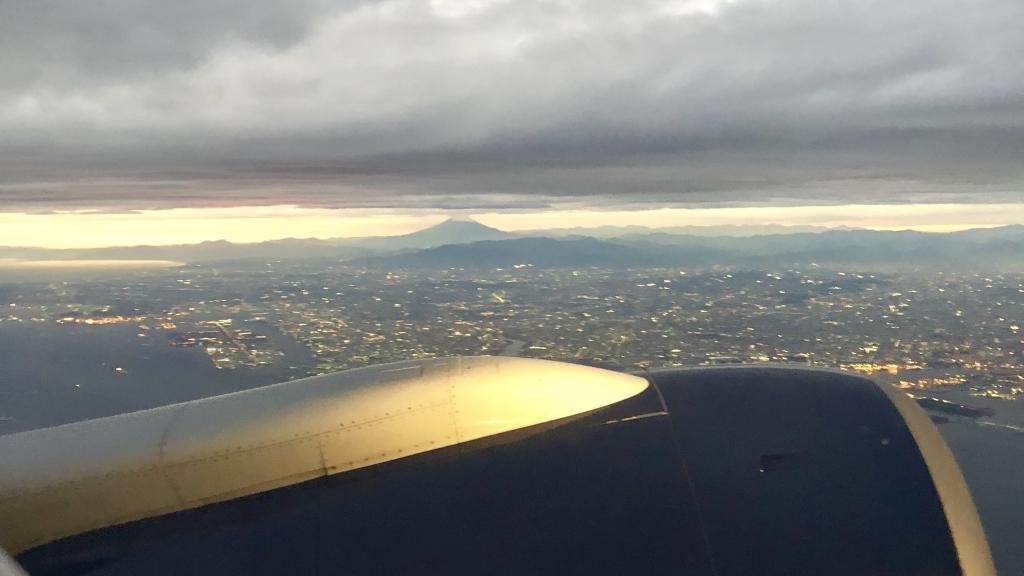 Mt. Fuji at sunset from a plane taking off at Haneda airport in Tokyo